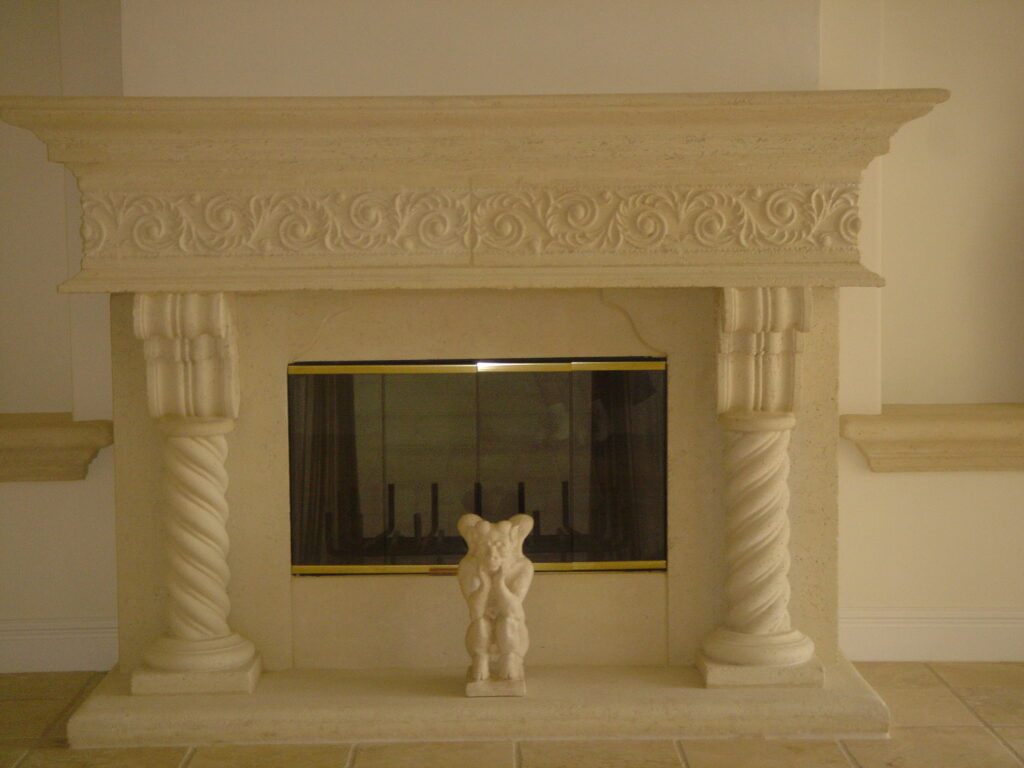 A Stone  Fireplace assembly with many custom pieces . no upper surround.